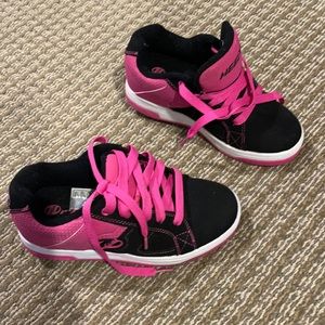 Black and hot pink Heeleys.